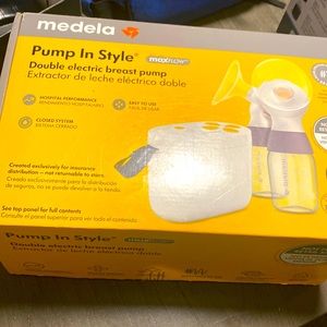 Brand new in box never used Medela breast pump.